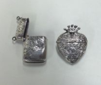A silver embossed vesta of heart shaped form toget