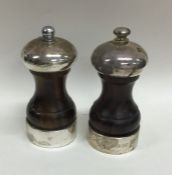 A matched pair of mahogany and silver mounted pepp