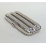 A heavy silver three finger cigar case with hinged