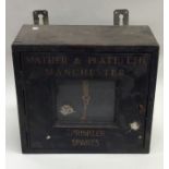 A novelty wooden key case entitled, 'Mather & Plat