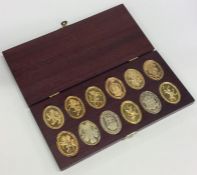 A good quality cased set of twelve silver gilt com