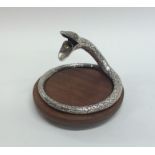 An unusual silver cigar cutter in the form of an e