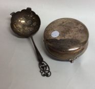 A silver mounted tea strainer together with a jewe