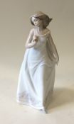LLADRO: A cased figure of a dancing lady in long d