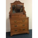 A satinwood dressing chest on bracket feet with ca