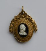 A rare Antique silver gilt medallion with wreath d