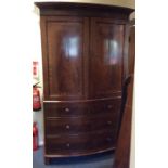 A Victorian mahogany four drawer bow fronted linen