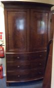 A Victorian mahogany four drawer bow fronted linen