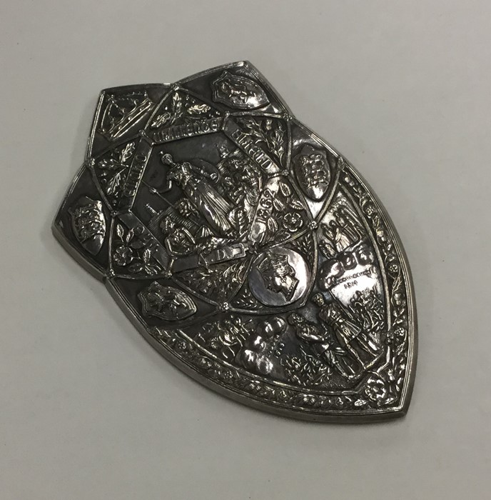 A large silver shield attractively decorated with