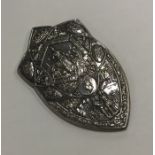 A large silver shield attractively decorated with
