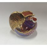 A Royal Crown Derby model of a cockerel in seated