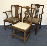A pair of Georgian mahogany carver chairs together