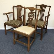 A pair of Georgian mahogany carver chairs together