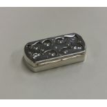 A stylish shaped top silver snuff box with gilt in