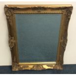 A gilt framed bevel edged wall mirror. Approx. 81