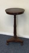 A Victorian rosewood pedestal occasional table. Es