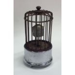 An unusual birdcage mounted as a clock on chrome b