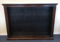 An Antique rosewood bookcase with shelved interior