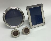 A collection of various silver picture frames. App
