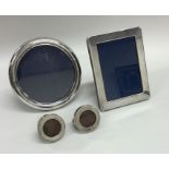 A collection of various silver picture frames. App