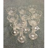 A set of eight unusual tapering glass champagne fl