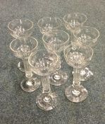 A set of eight unusual tapering glass champagne fl