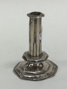 A miniature Queen Anne silver taper stick on stepp