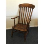 An Antique shaped back kitchen chair. Est. £30 - £