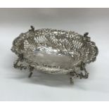 A large embossed silver bonbon dish decorated with