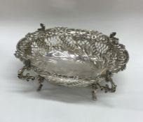 A large embossed silver bonbon dish decorated with