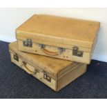 Two velum suitcases with chrome locking mechanisms