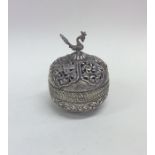 A heavy Indian silver box attractively embossed wi