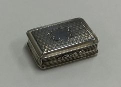 A Georgian silver hinged top vinaigrette with gilt