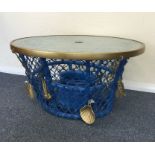 A novelty glass top occasional table in the form o