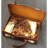 An old suitcase containing copper and other pennie