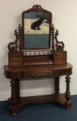 A Victorian mahogany Duchess dressing table of typ