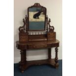 A Victorian mahogany Duchess dressing table of typ