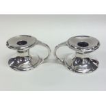 A pair of stylish Scottish silver candlesticks of