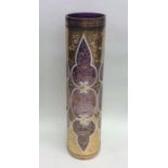 An attractive tall amethyst glass vase painted wit
