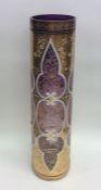 An attractive tall amethyst glass vase painted wit