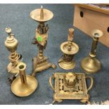 An Antique brass candlestick together with other b