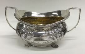 A good quality Georgian silver embossed sugar bowl