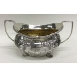 A good quality Georgian silver embossed sugar bowl