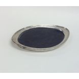 An ebony and silver letter tray of oval form. Shef