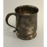 An Edwardian silver christening cup on spreading b