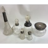 A collection of silver and cut glass mounted scent