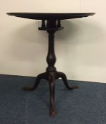 A Georgian mahogany pedestal wine table with birdc