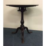 A Georgian mahogany pedestal wine table with birdc