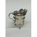 A small Edwardian silver cream jug with card cut r