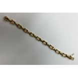 An 18 carat gold textured link bracelet with conce